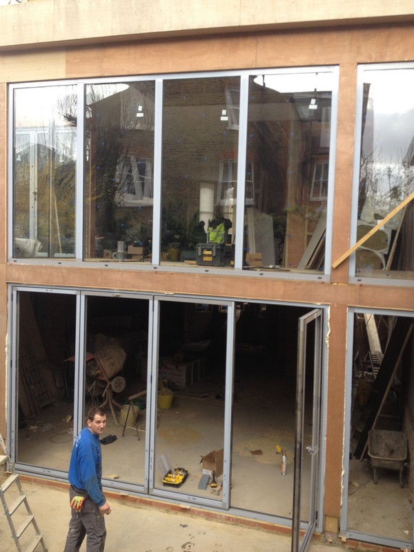 Aluminium bi-fold doors with two-storey glazing in Harlesden